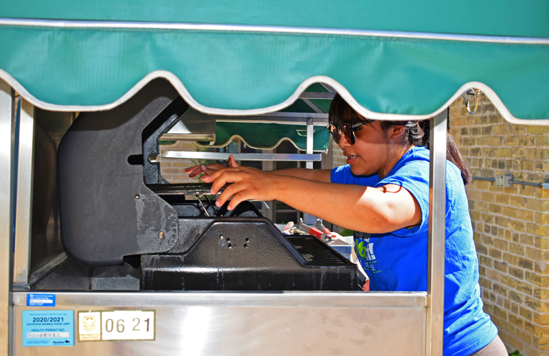 woman working in food cart